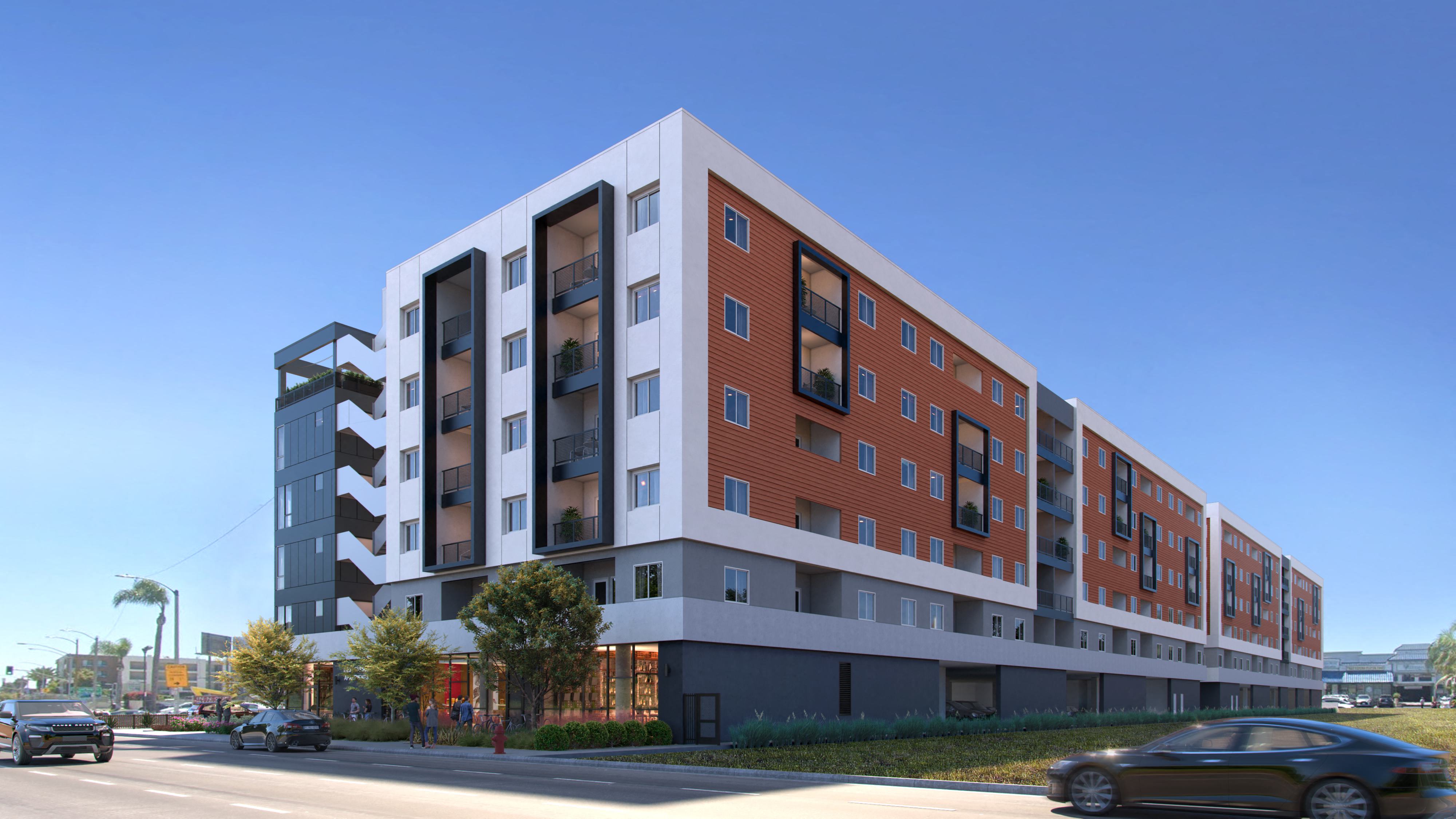 A modern multi-story building with a mix of red and white colors at Tellus on Carson Apartments in Torrance, CA, 90502